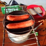 Smokie sausages on a stove top grill
