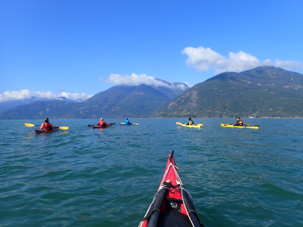 sea kayakers crossing to the Defence Islands in Howe Sound, British Columbia
