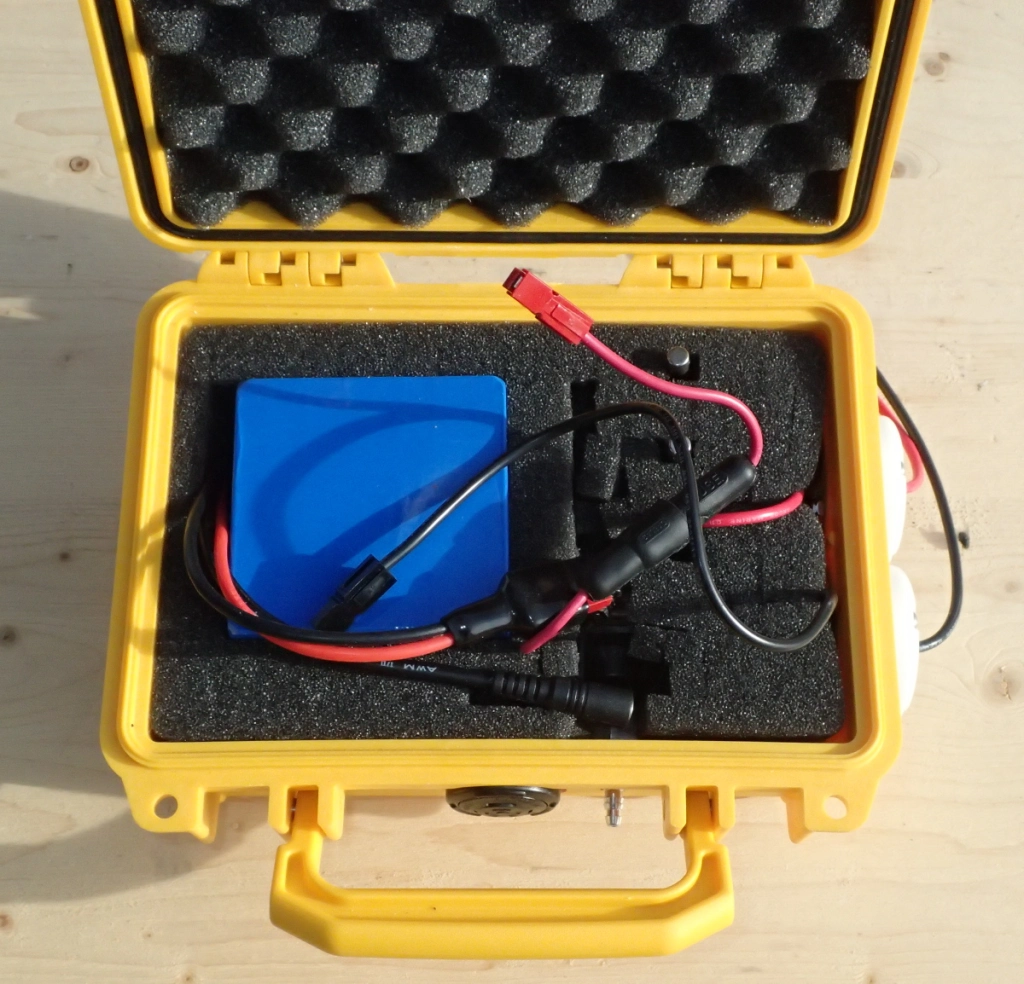 the waterproof box containing the battery and air switch for an electric bilge pump for my sea kayak