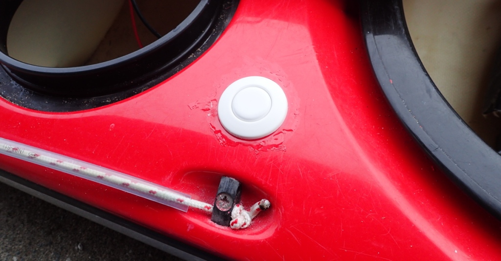 Showing the air button switch for my electric bilge pump mounted on the rear deck of my sea kayak.