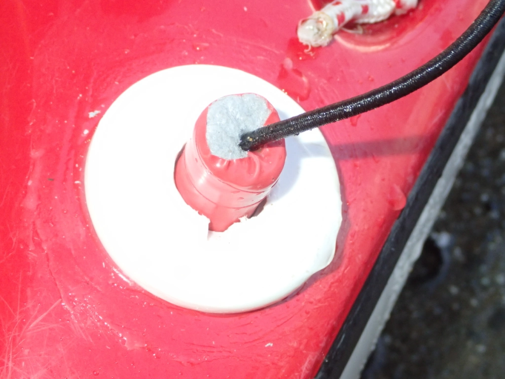 Showing a home made foam cork sealing the top of a mushroom head to prevent flooding into the boat.