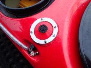 Showing a silicone cover for the air button of an electric bilge pump in a sea kayak